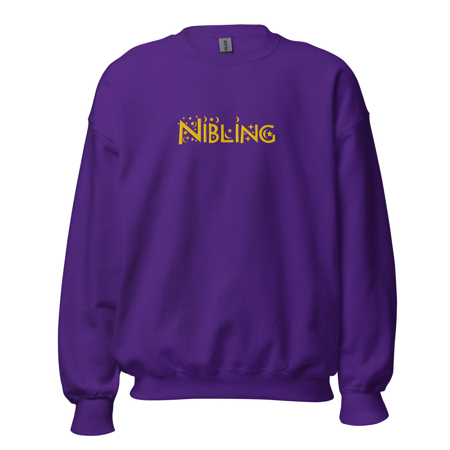 Unisex purple crewneck with “Nibling” embroidered across the chest in gold thread; inclusive design by Galactic Flow