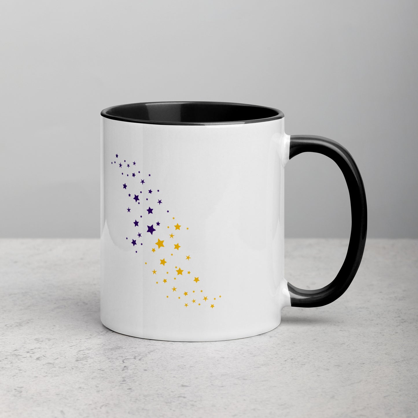 Back view of white ceramic mug with black handle and interior, featuring a celestial pattern of purple and yellow stars arranged diagonally; designed by Galactic Flow for cosmic self-expression