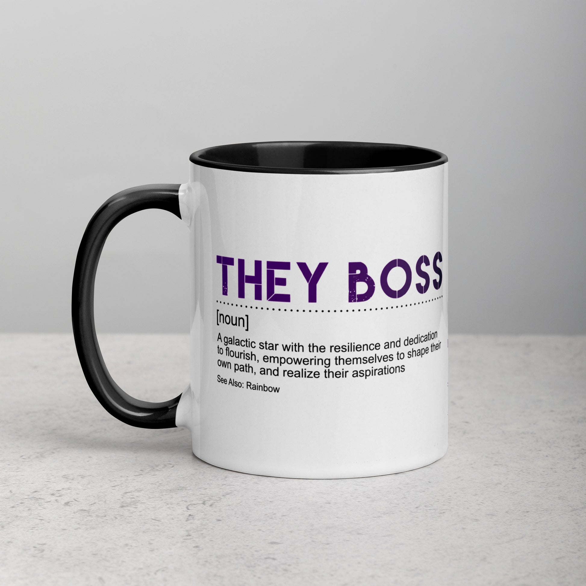 Front view of white ceramic mug with black handle and interior, featuring bold purple text: “THEY BOSS [noun] A galactic star with the resilience and dedication to flourish…”; designed by Galactic Flow for gender-inclusive empowerment