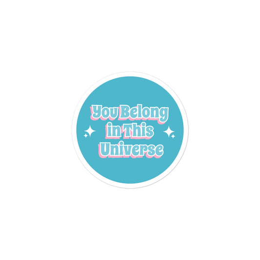 Circular sticker with 'You Belong in This Universe' text on a white background