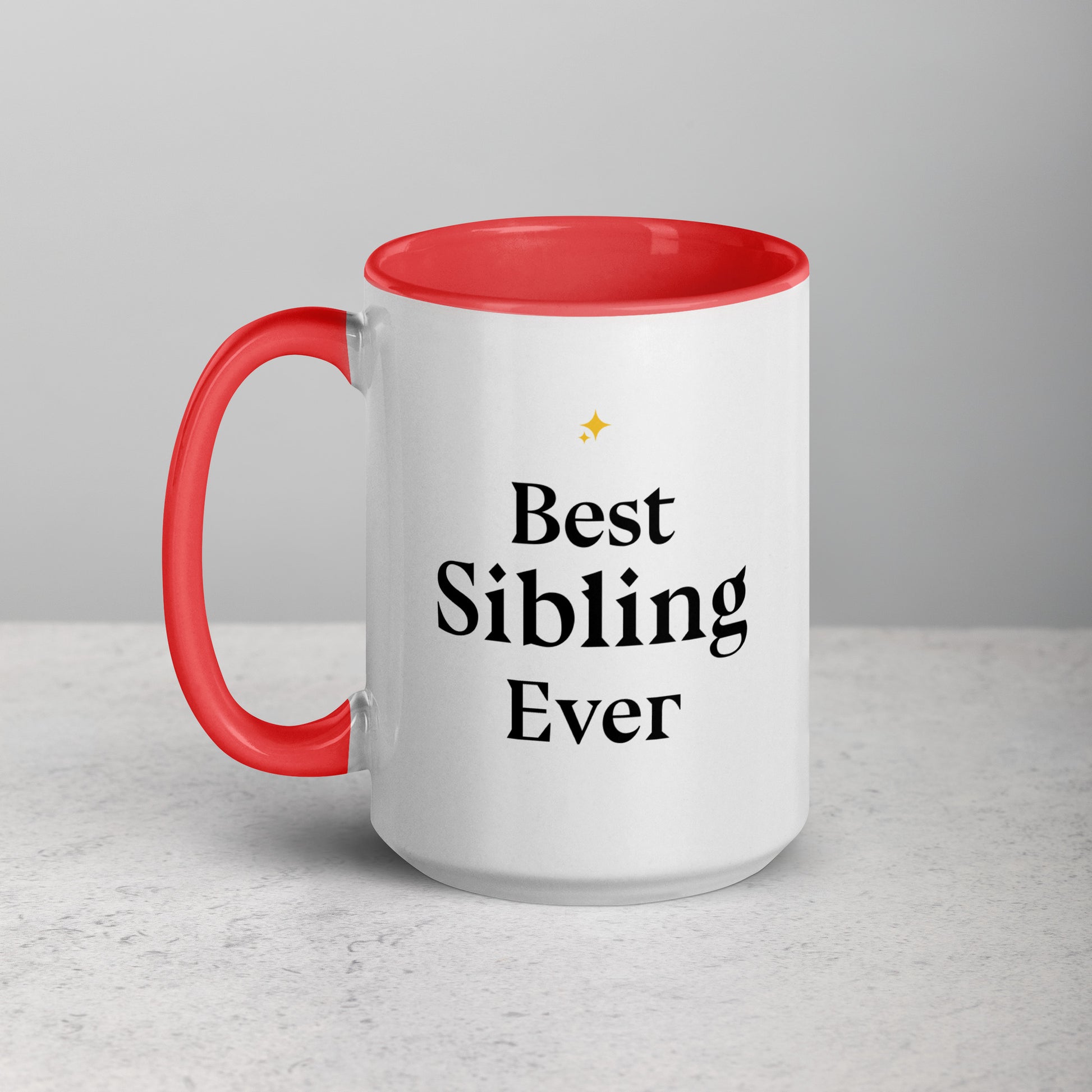 White mug with red interior and handle, featuring 'Best Sibling Ever' text on a light gray background.
